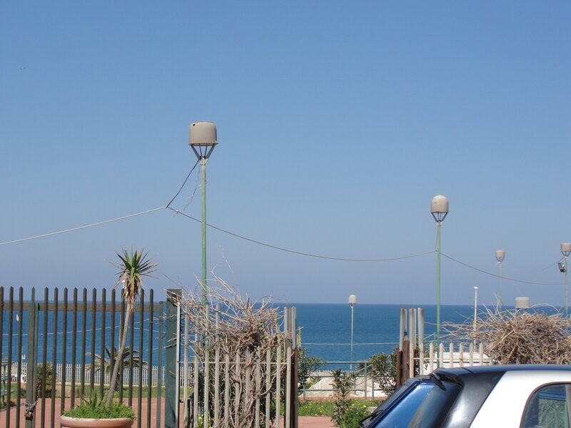 Ocean view with street lamps