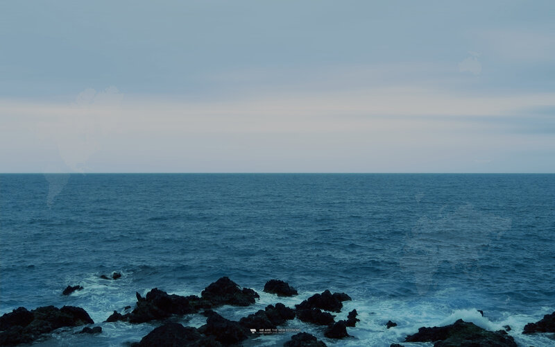 Ocean view with world map overlay