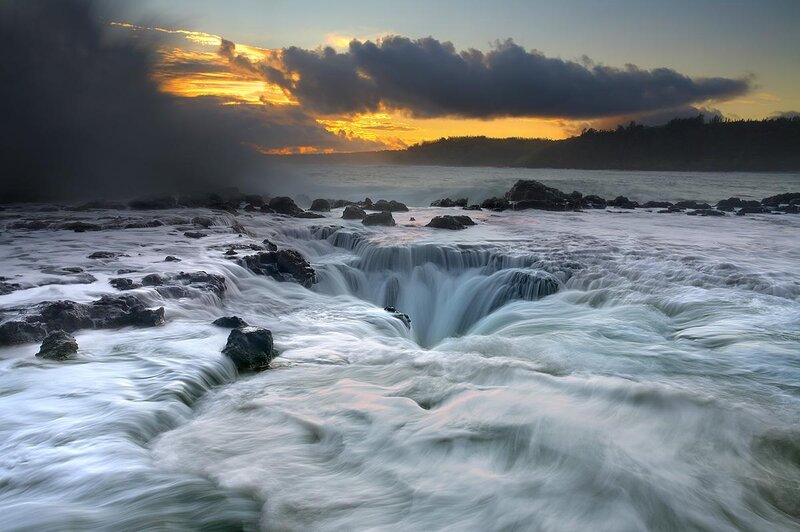 Ocean waterfall at sunset