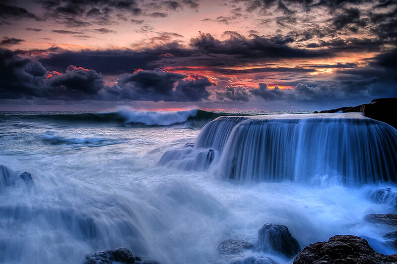 Ocean Waterfall at Sunset — Blue, Dramatic