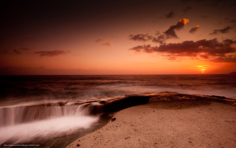 Ocean Waterfall at Sunset — Orange, Dramatic, Photograph, Rocks, Clouds