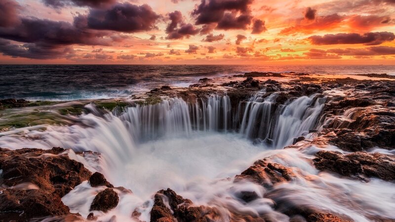 Ocean Waterfall at Sunset — Orange, Dramatic, Photograph, Rocks, Sky