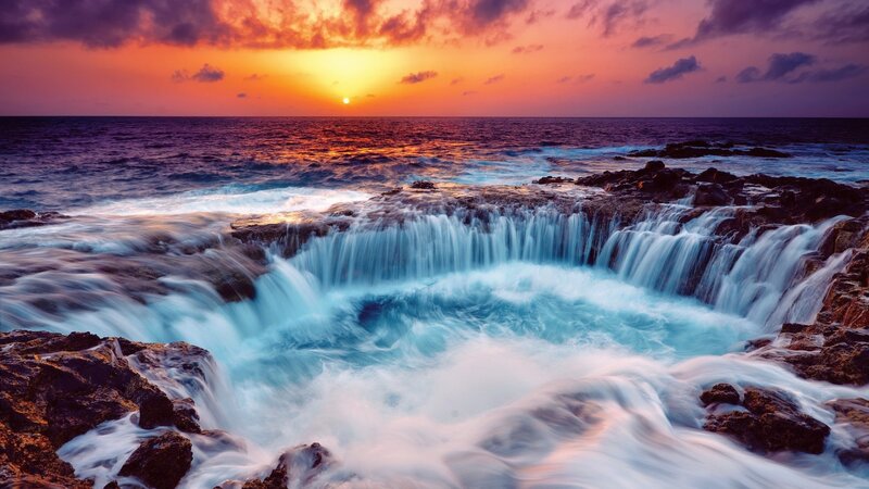 Ocean Waterfall at Sunset — Orange, Dramatic, Photograph, Rocks