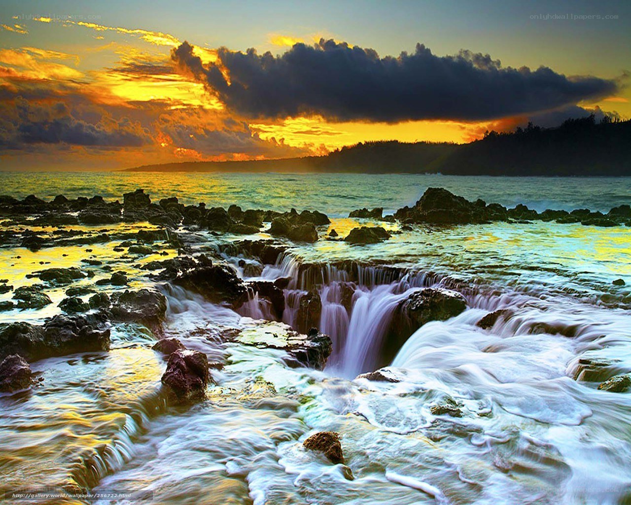 Ocean waterfall at sunset