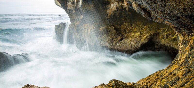 Ocean waterfall in coastal cave