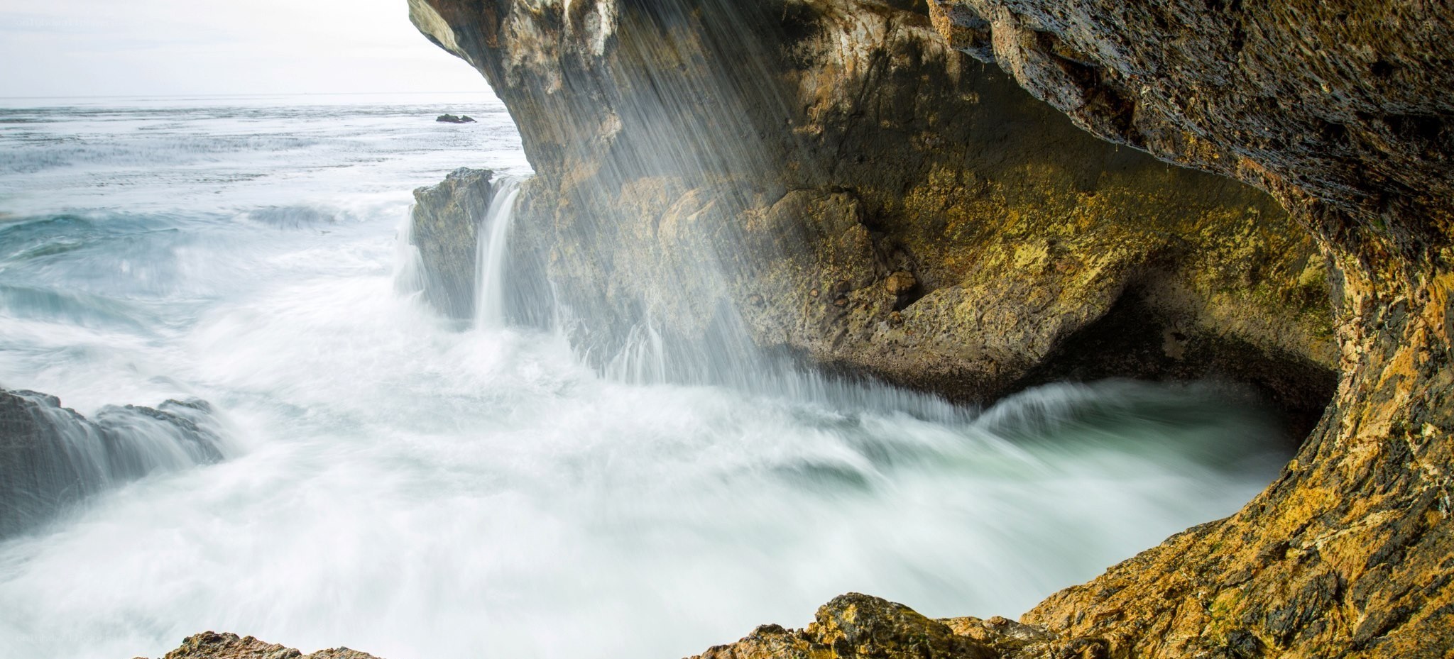 Ocean waterfall in coastal cave