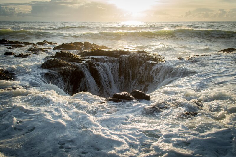Ocean Waterfall on Rocks — Blue