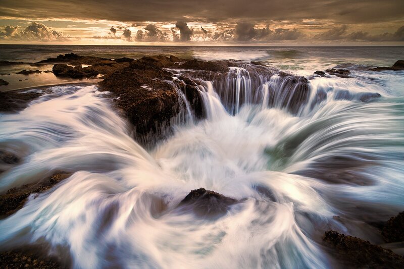 Ocean Waterfall on Rocks — White, Dramatic, Sunset