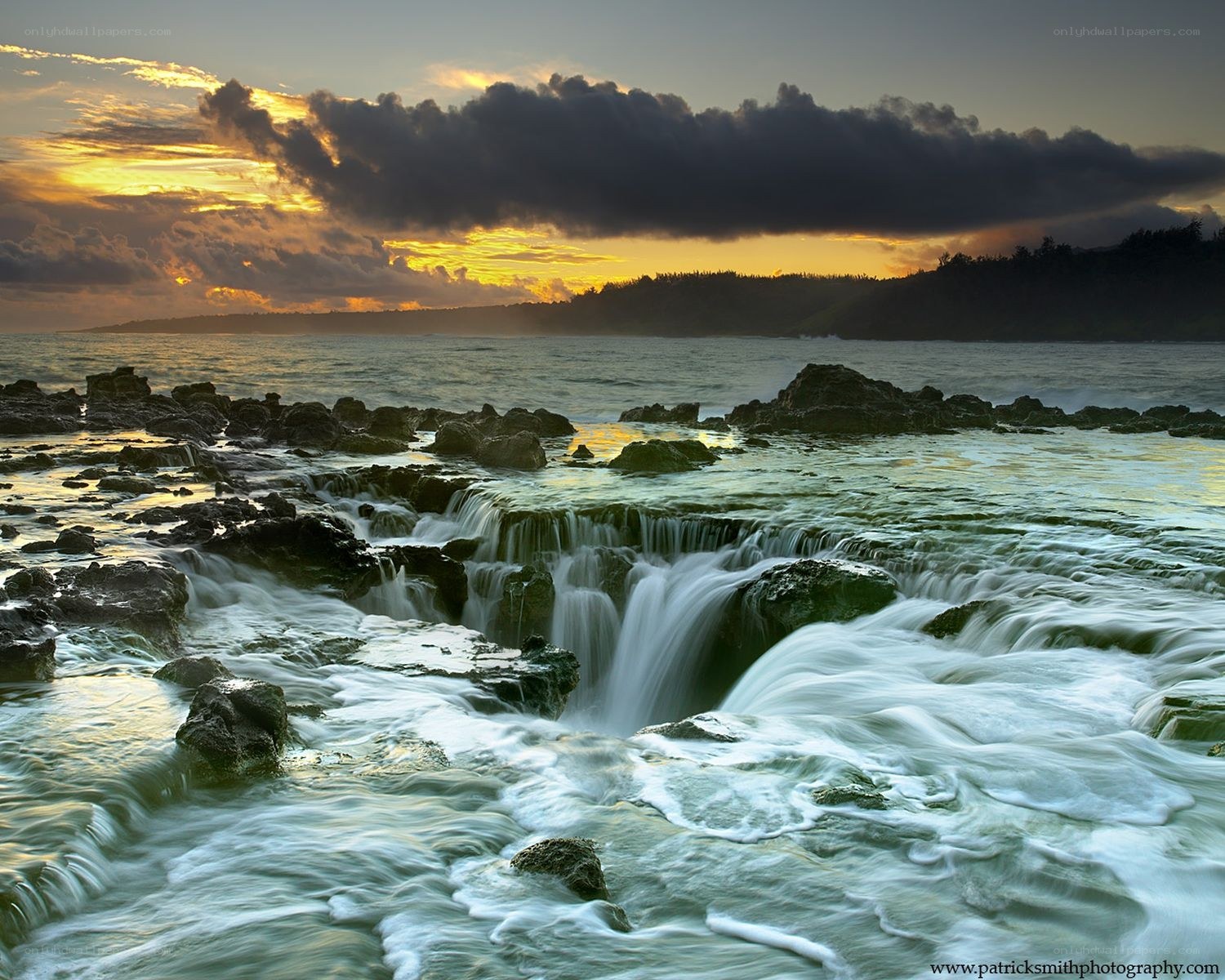 Ocean waterfalls at sunset