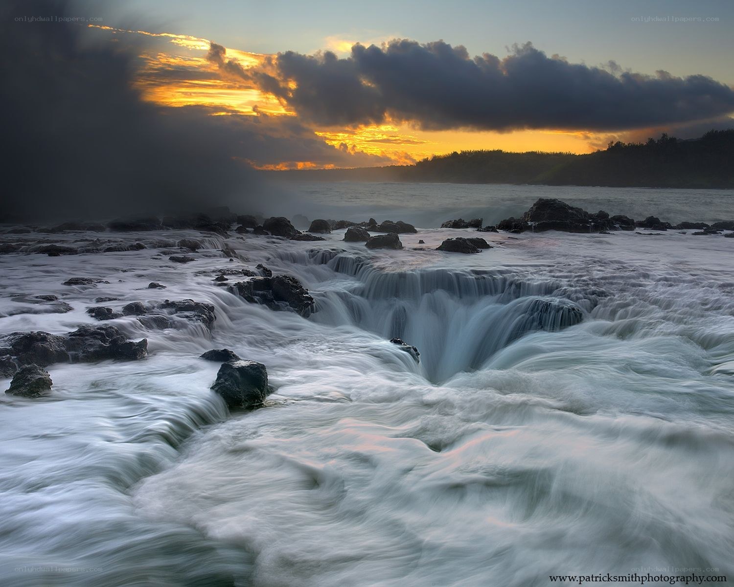 Ocean waterfalls at sunset