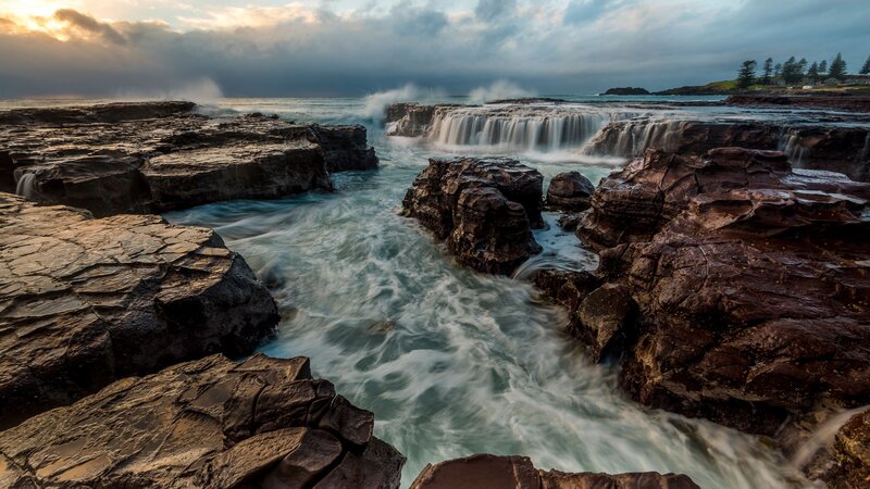 Ocean Waterfalls on Rocks — Blue, Dramatic, Sunset