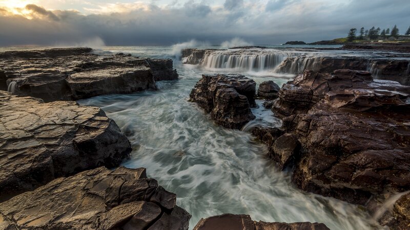 Ocean Waterfalls on Rocks — Gray