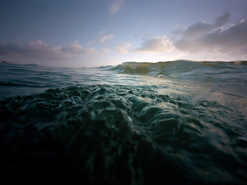 Ocean wave at sunset