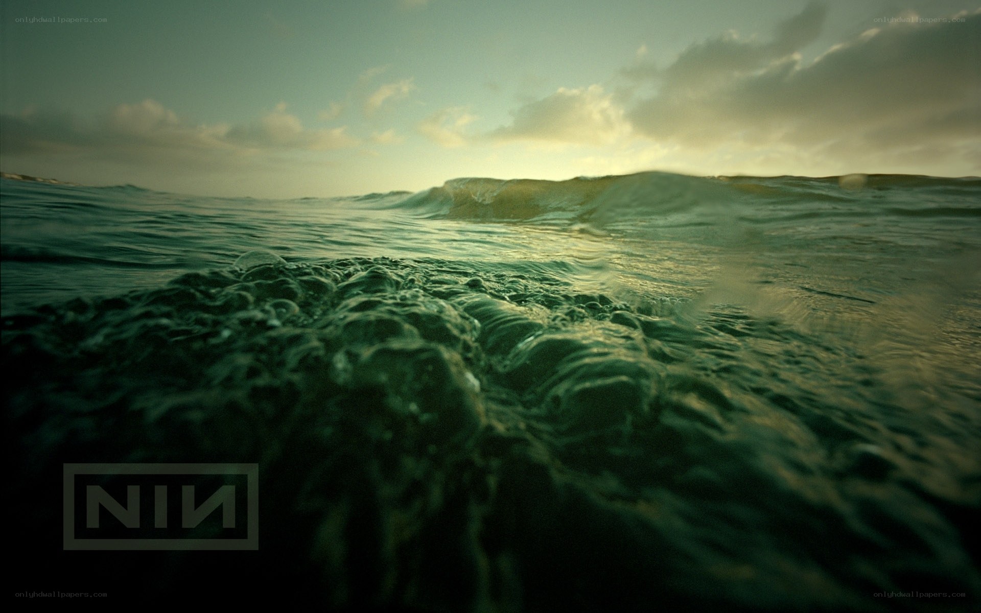 Ocean wave at sunset