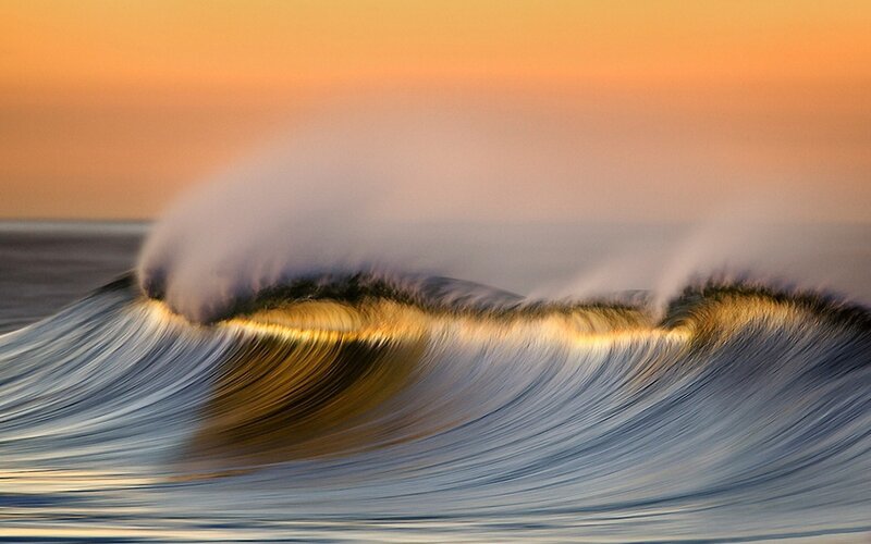 Ocean wave at sunset