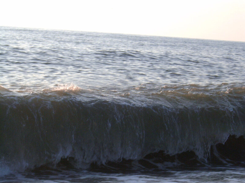 ocean wave at sunset