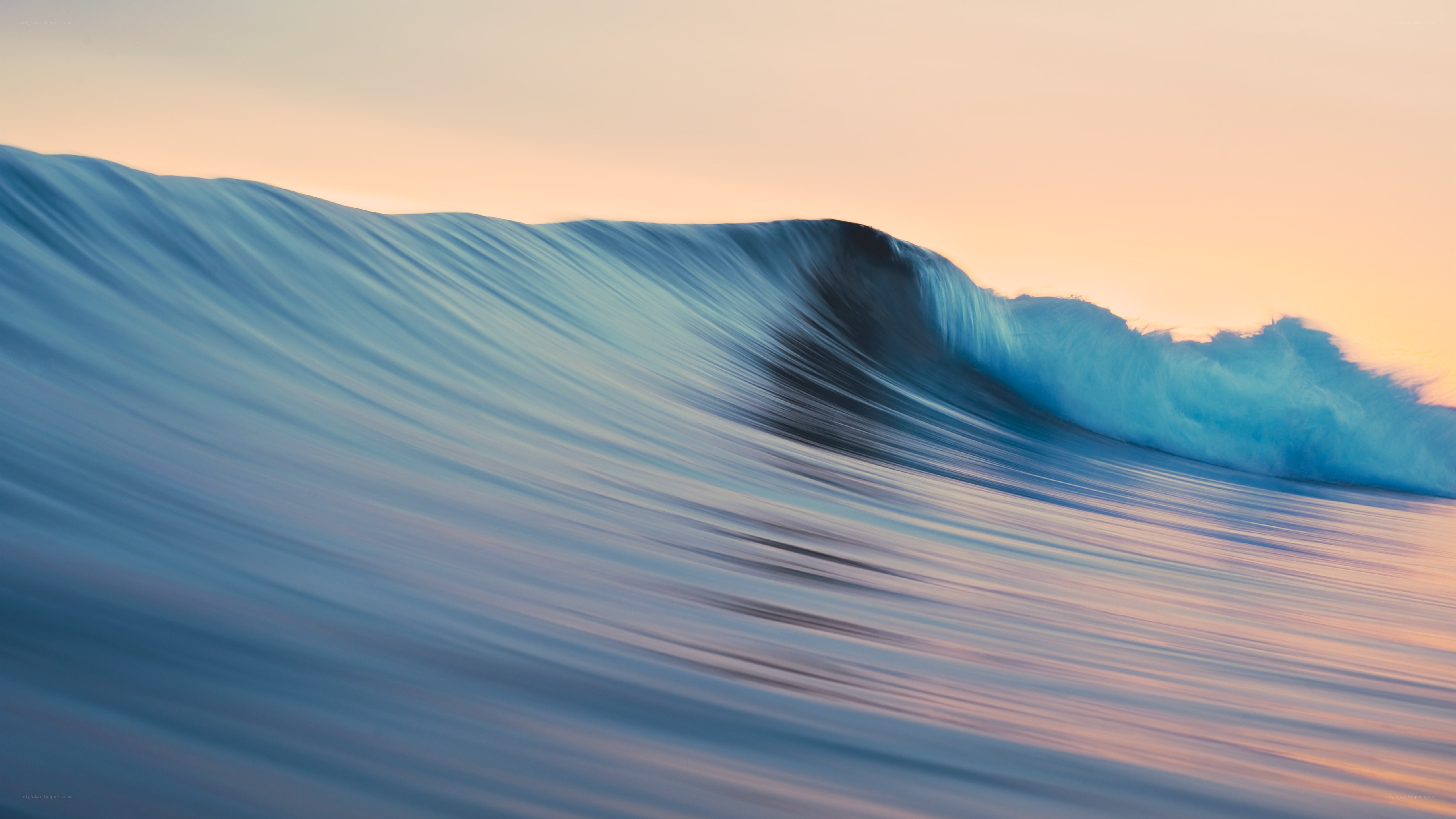 Ocean wave at sunset