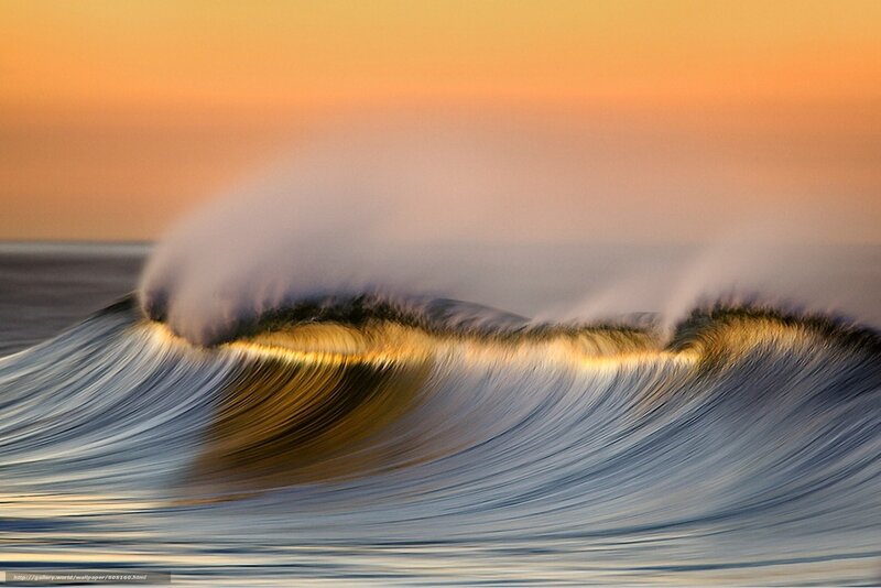 Ocean wave at sunset