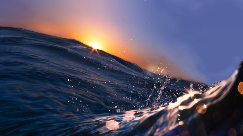 Ocean Wave at Sunset — Blue, Dramatic, Photograph, Sun, Sky, Splashing Water