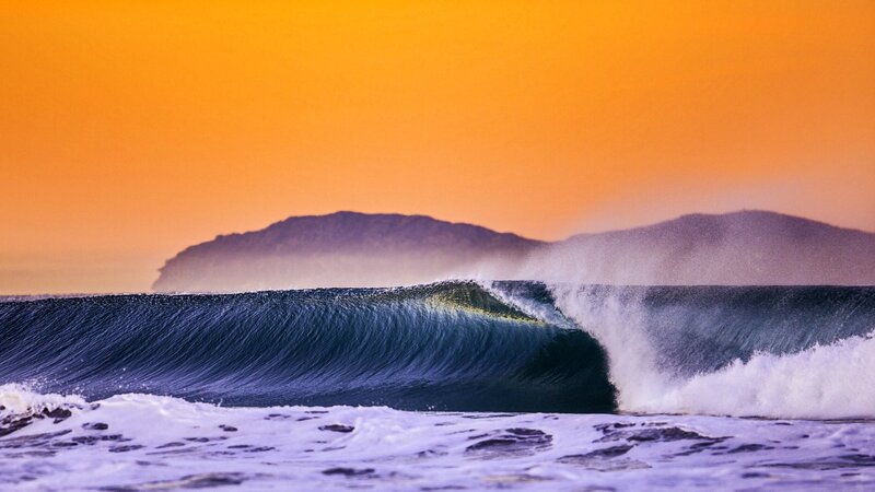 Ocean Wave at Sunset — Orange, Dramatic, Photograph, Mountain, Sky