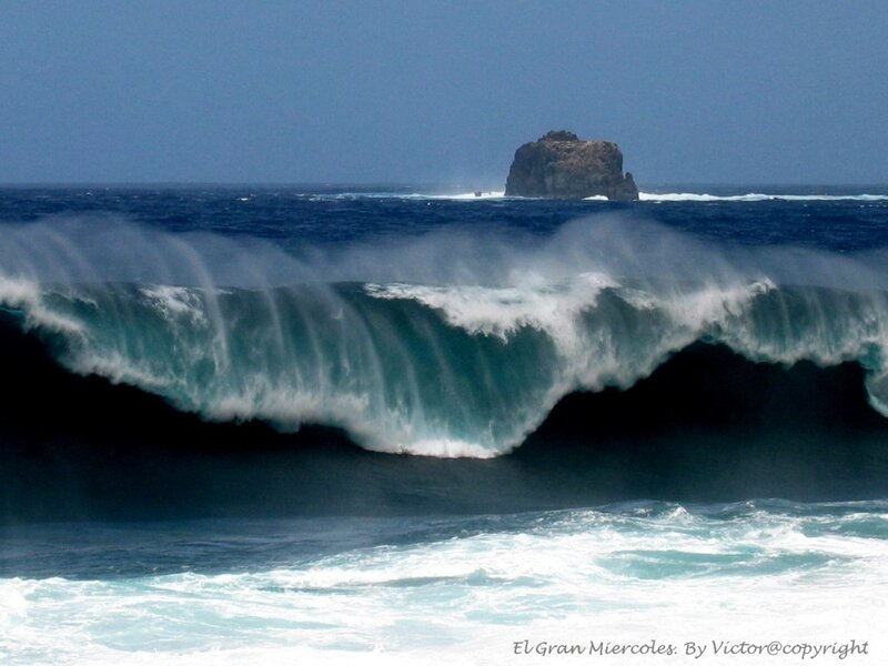 Ocean wave crashing near rock
