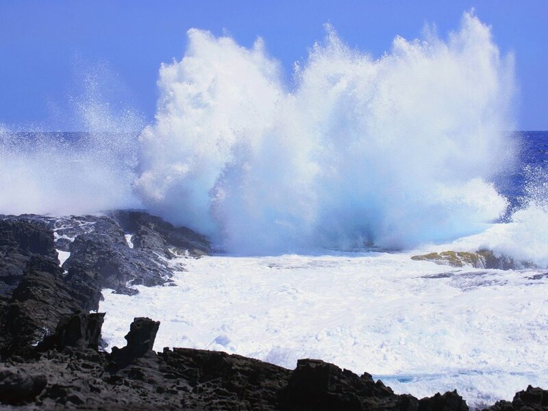Ocean wave crashing on rocks
