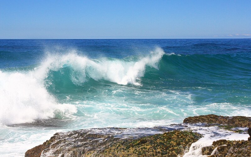 Ocean wave crashing on rocks