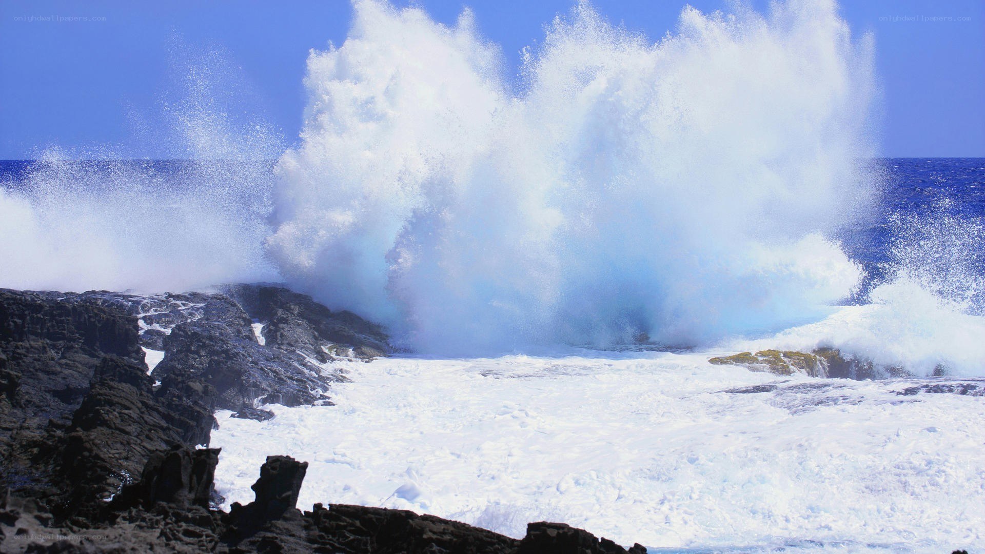 Ocean wave crashing on rocks