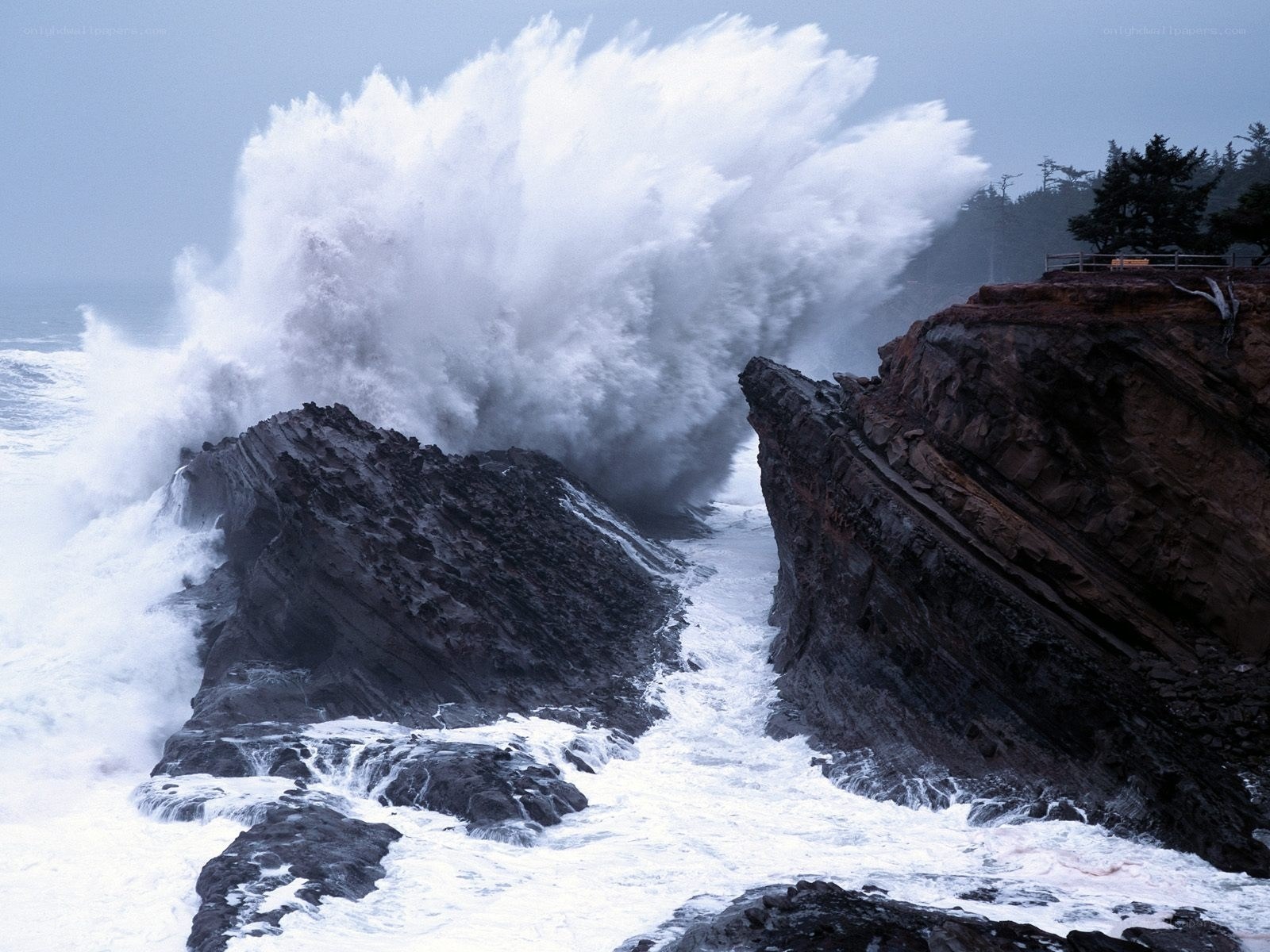 Ocean wave crashing on rocks