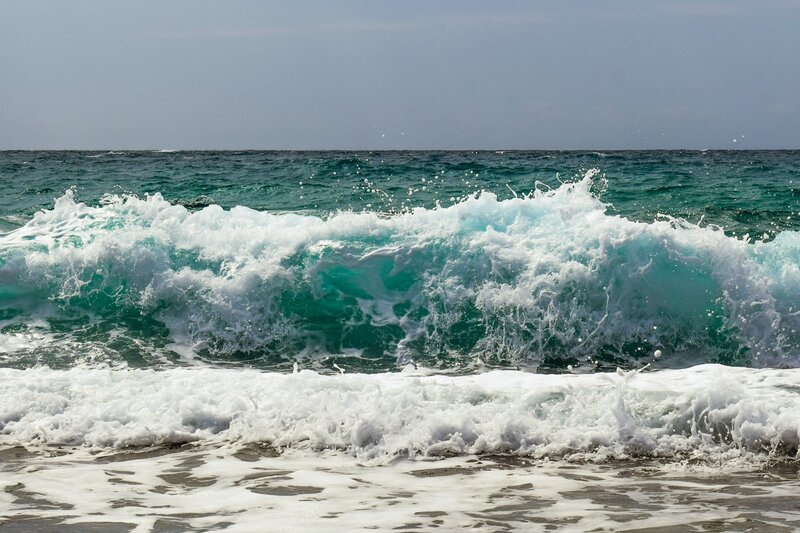 Ocean wave crashing on shore