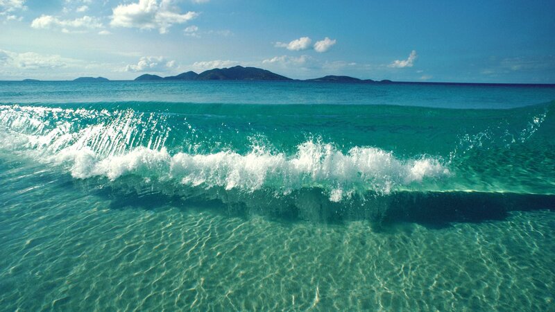 Ocean wave crashing on shore