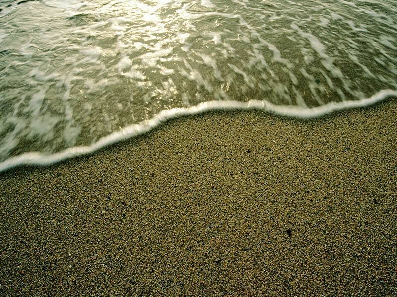 ocean wave on sandy beach