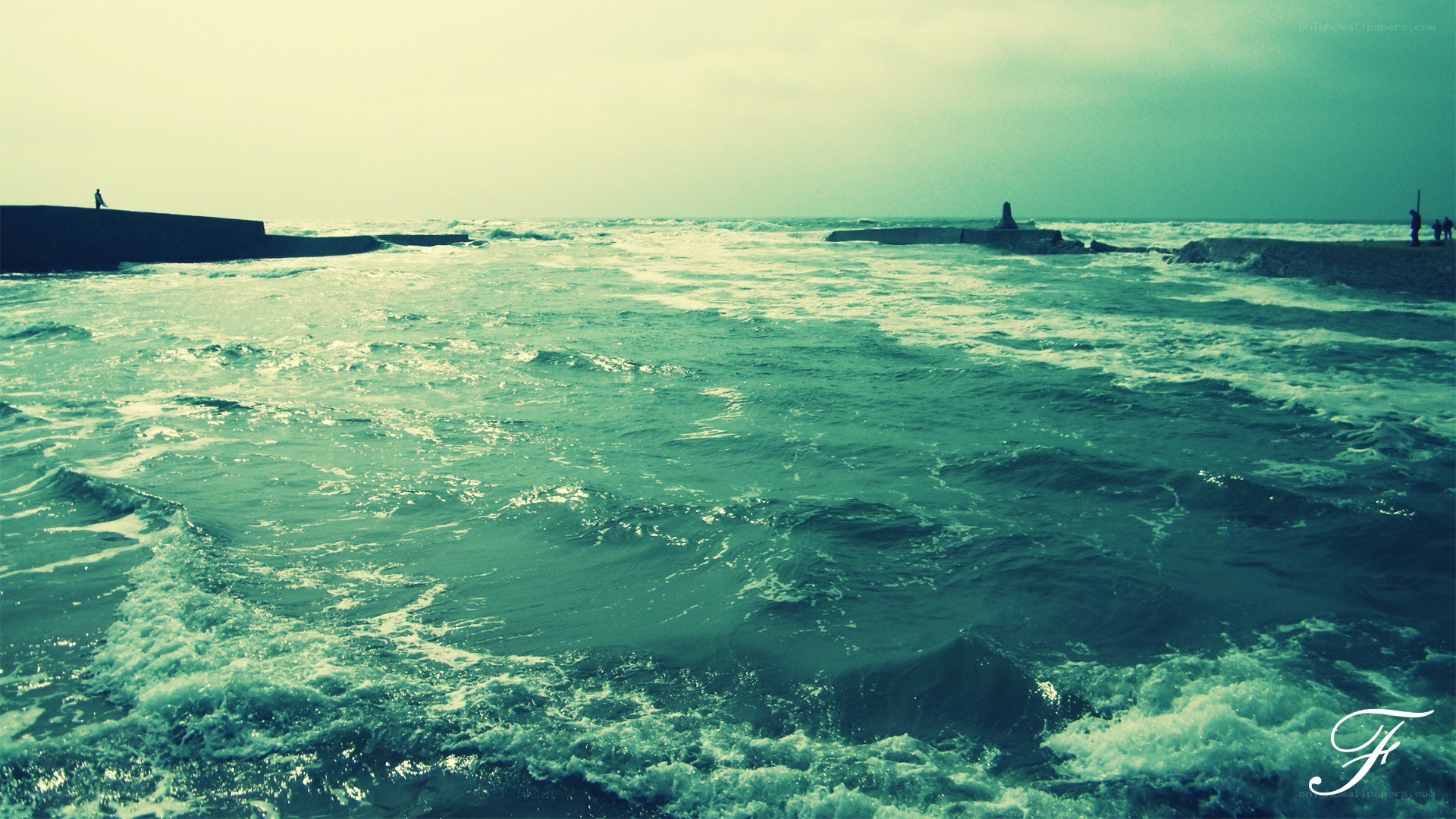 Ocean waves at a breakwater