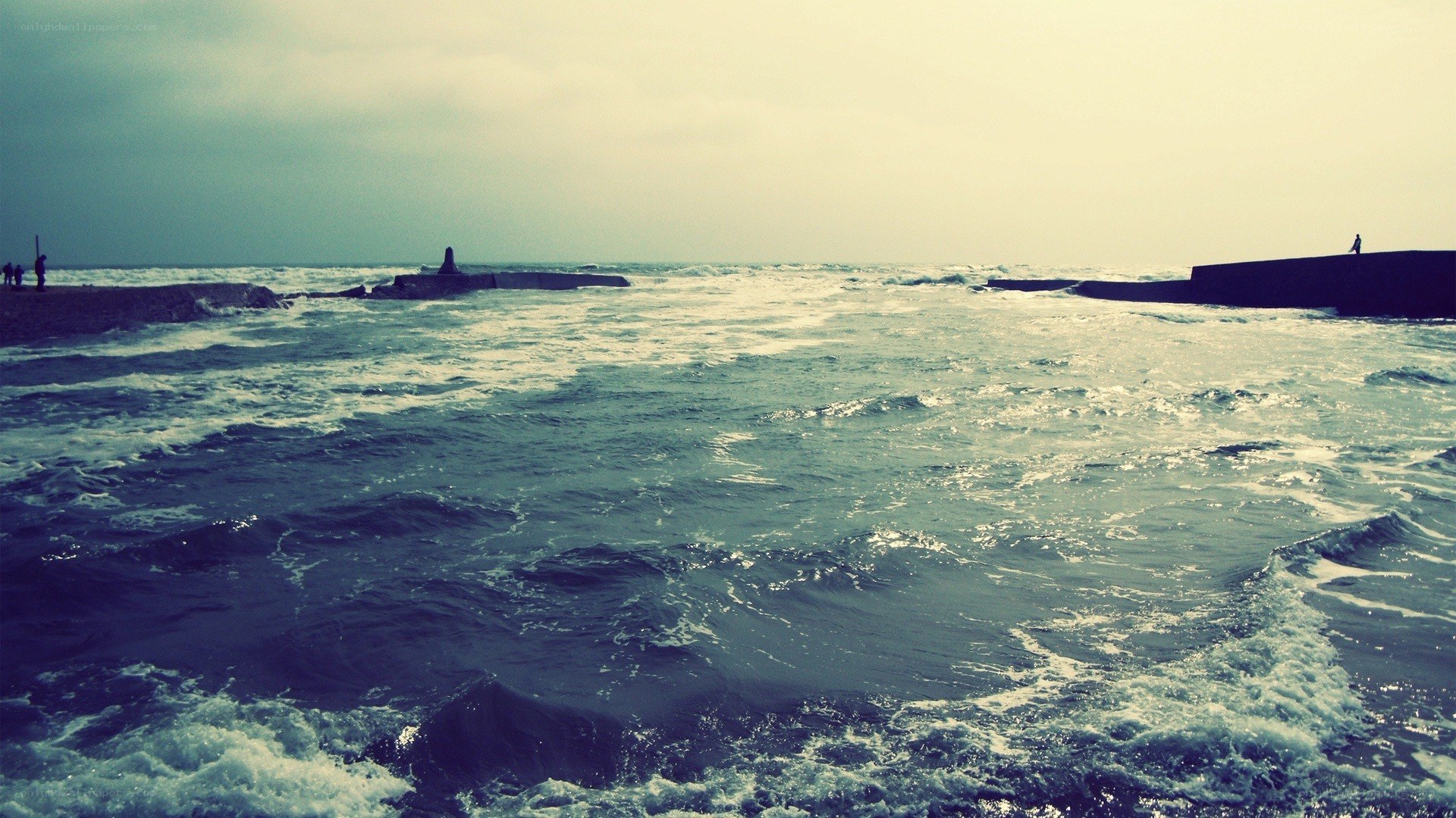 Ocean waves at a breakwater