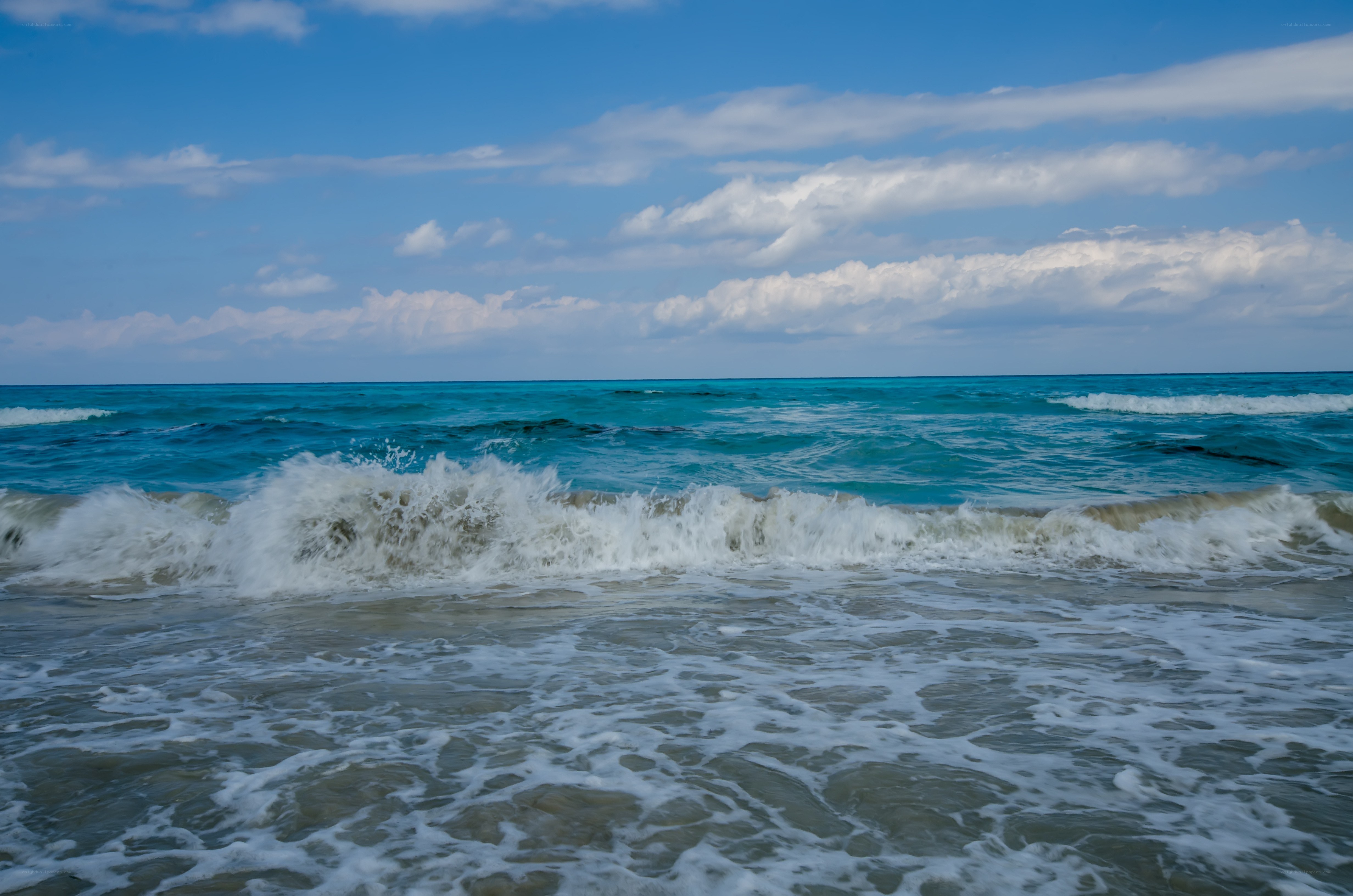 Ocean waves at a sunny beach