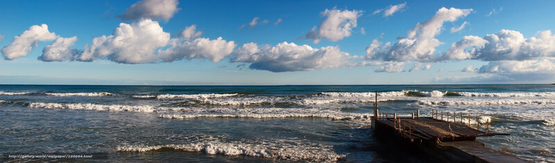 Ocean waves at a wooden pier