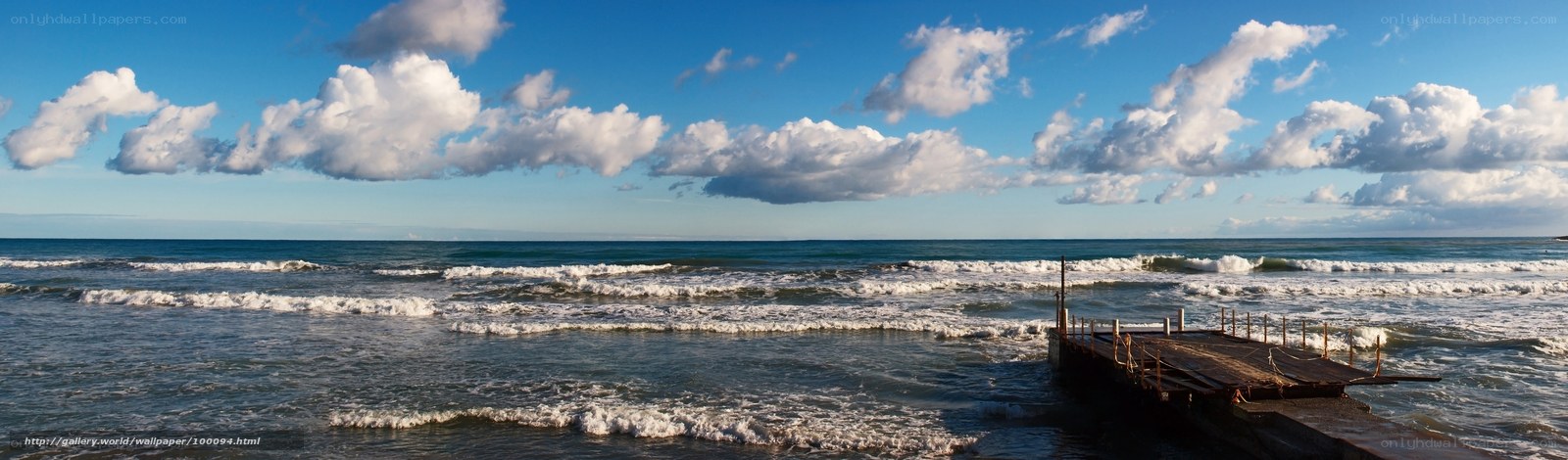 Ocean waves at a wooden pier