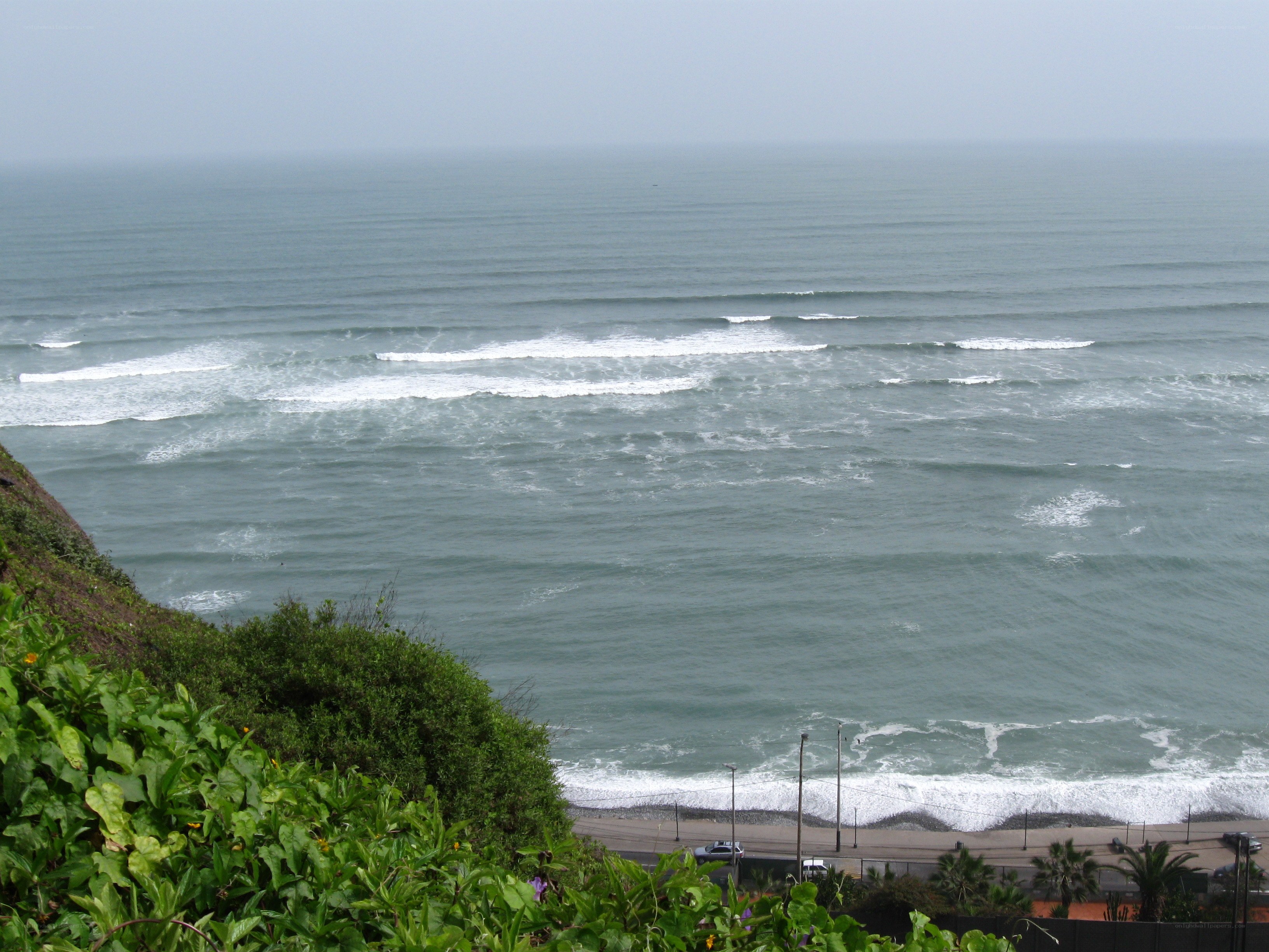 ocean waves at coastal cliff
