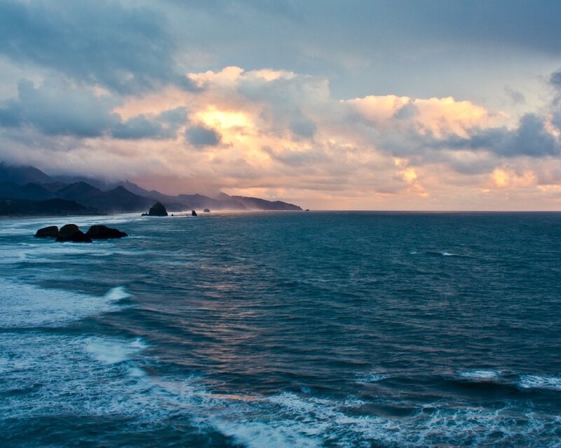 Ocean Waves at Coastline — Blue, Dramatic, Sunset, Photograph, Mountains, Rocks