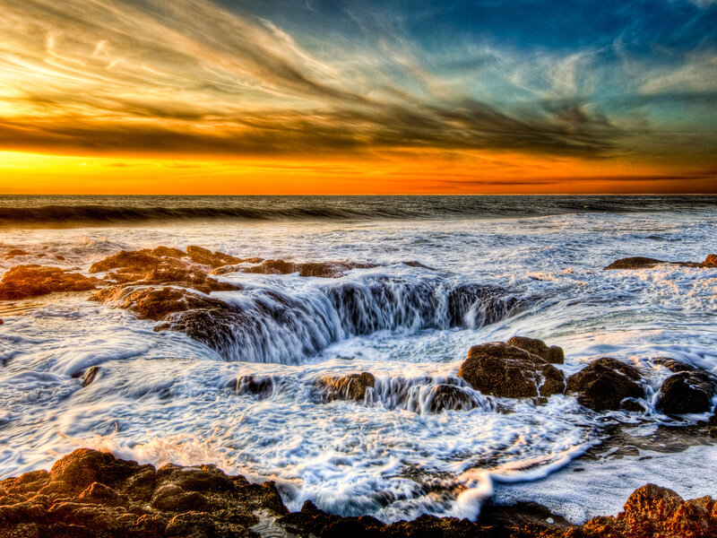 Ocean Waves at Rock Formation — Orange, Dramatic, Sunset