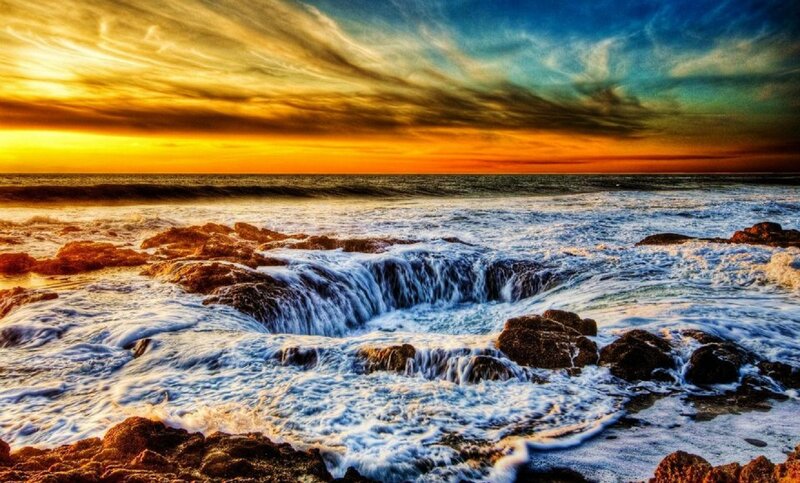 Ocean Waves at Rock Formation — Orange, Dramatic