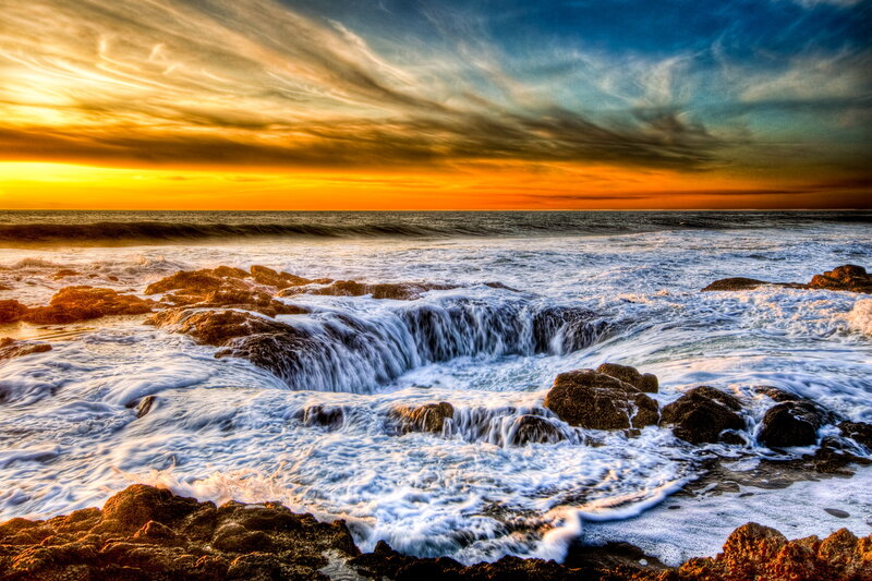 Ocean Waves at Rock Formation — Orange
