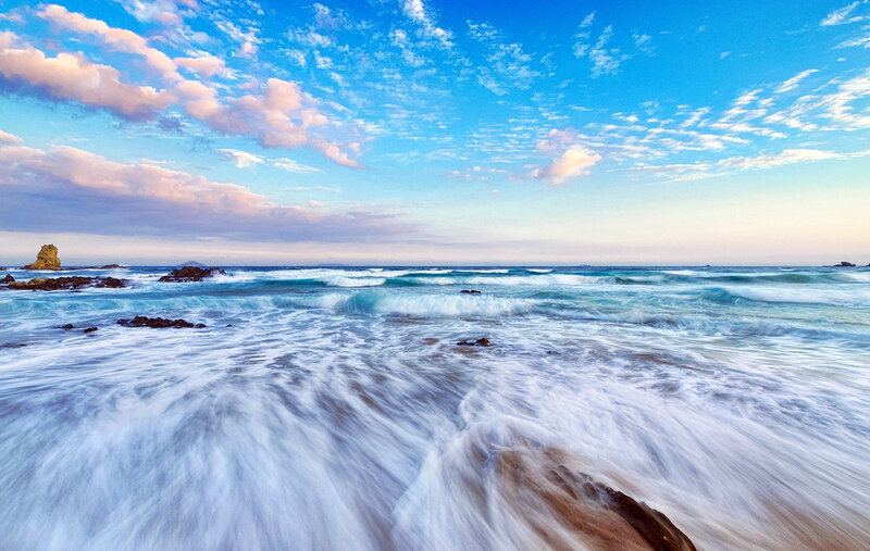 Ocean Waves at Rocky Shore — Blue, Serene, Sunrise