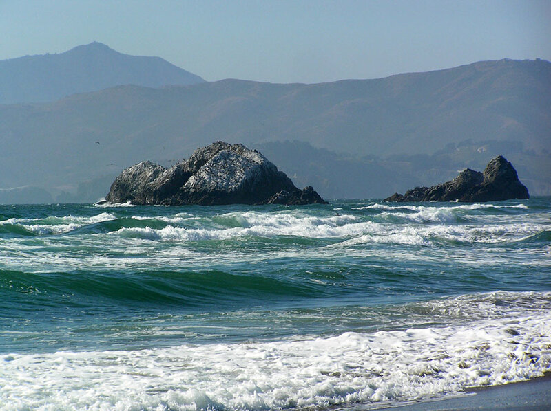 Ocean Waves at Rocky Shore — Blue