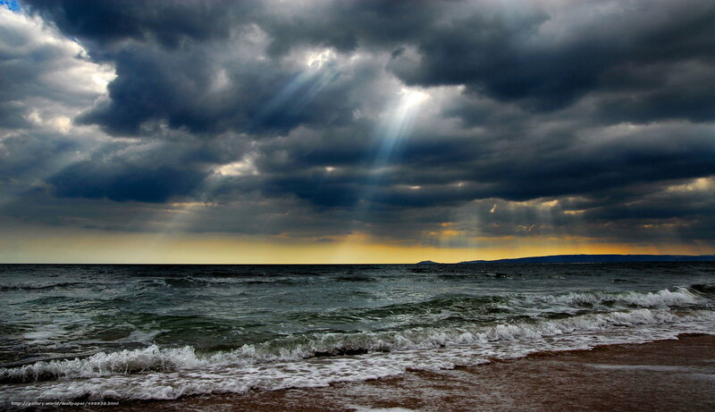 Ocean Waves at Stormy Sunset