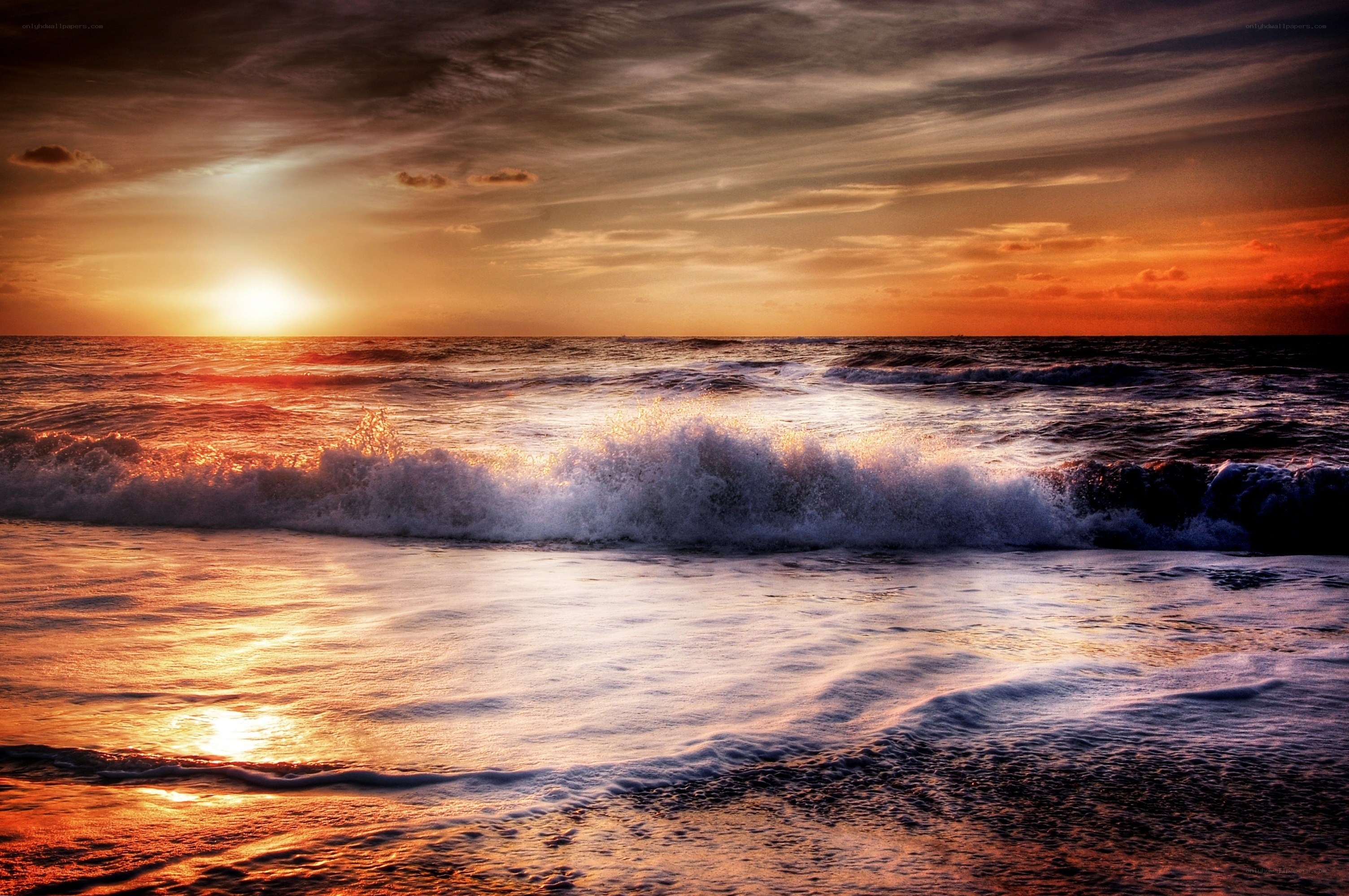 Ocean waves at sunset