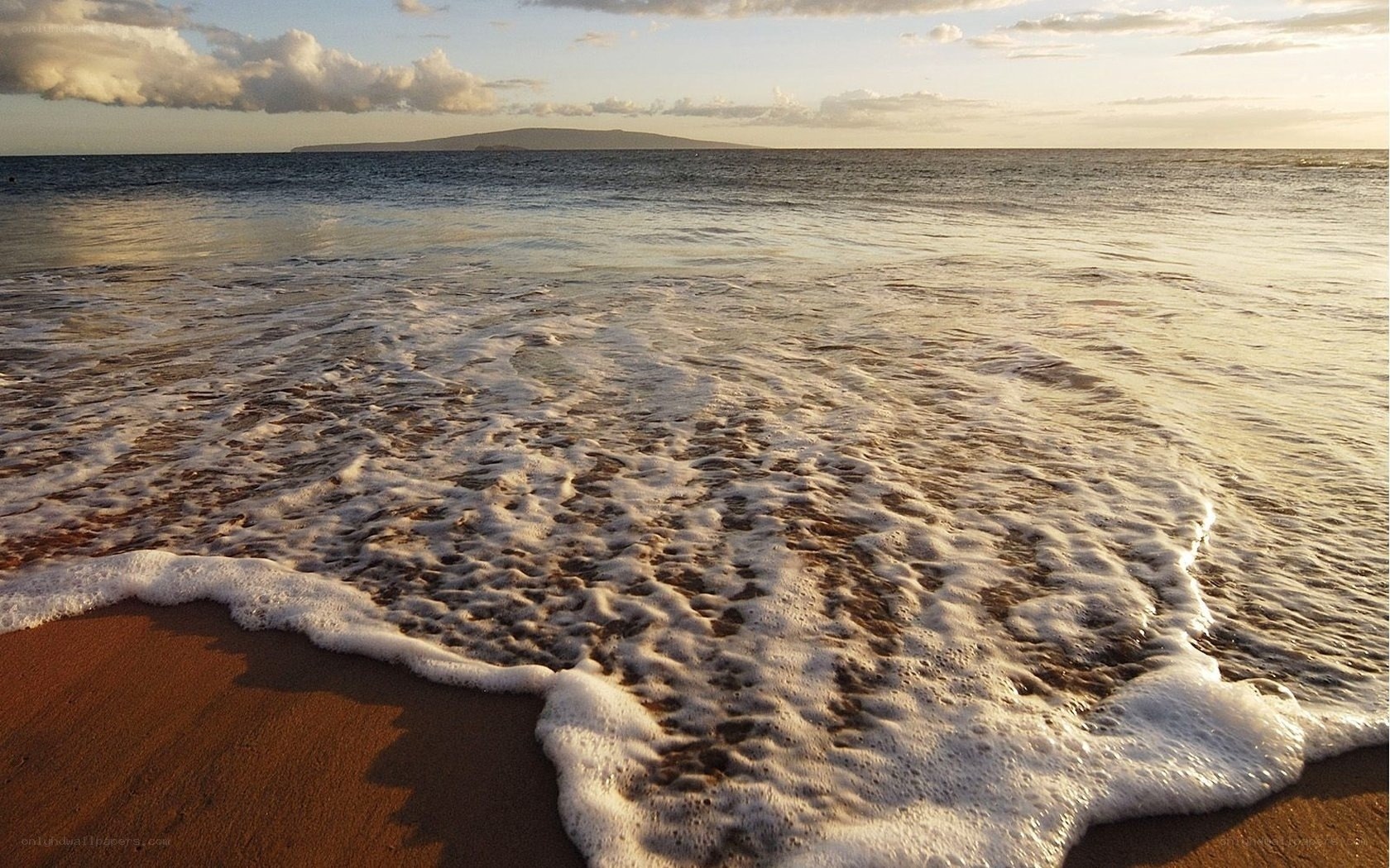 Ocean waves at sunset