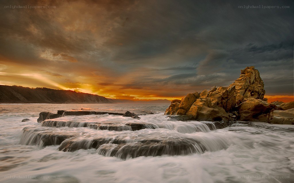 Ocean waves at sunset