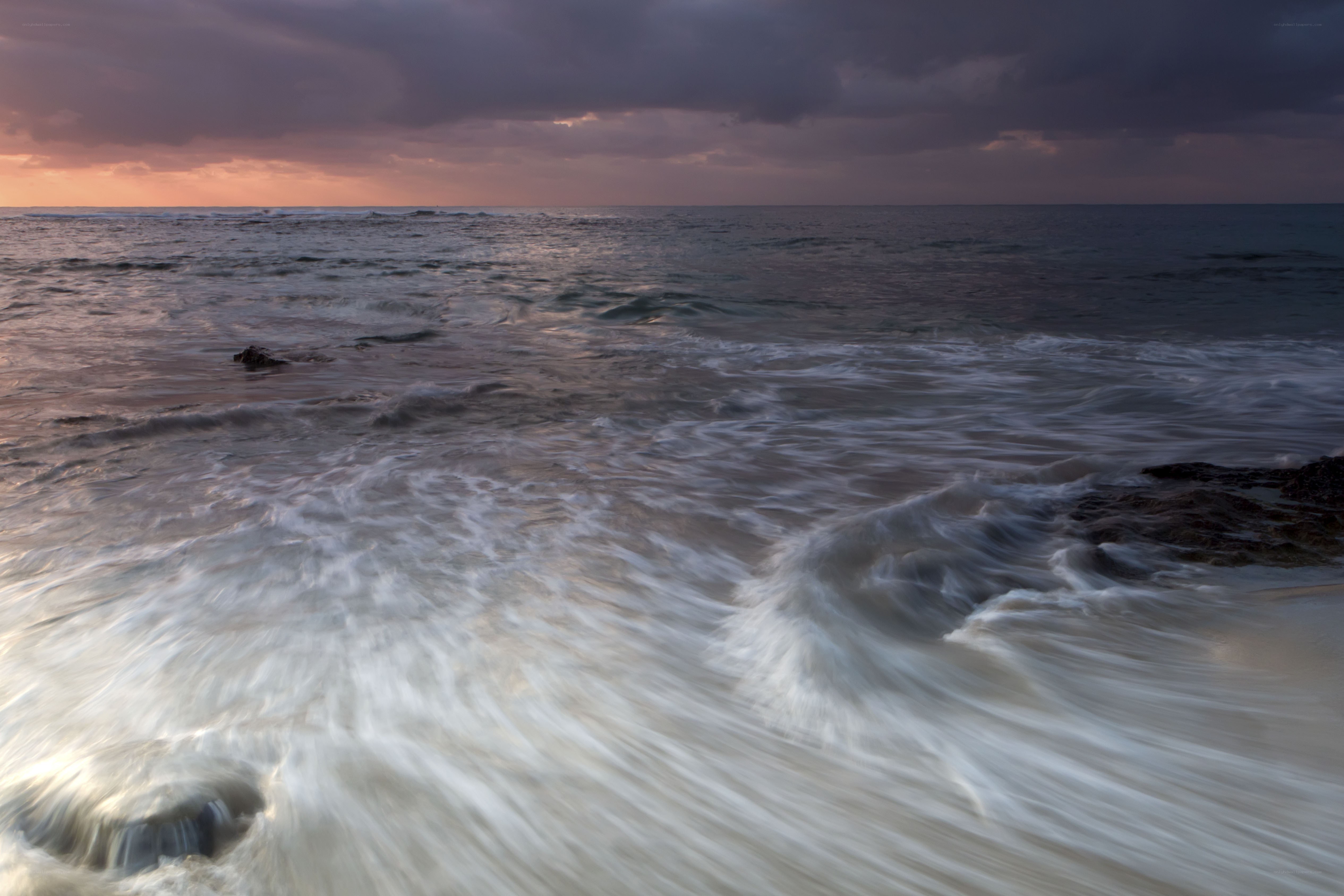 Ocean waves at sunset
