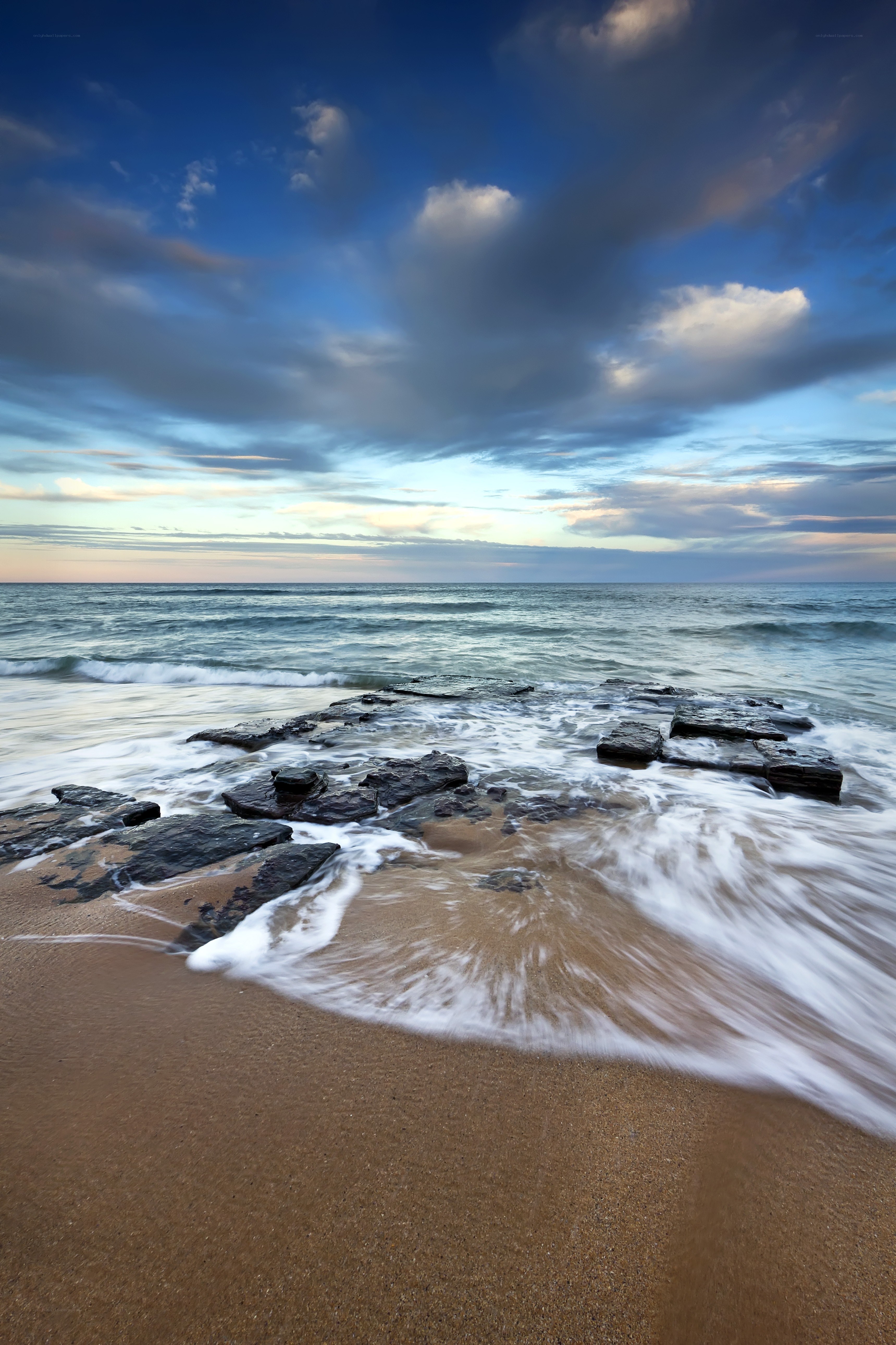 Ocean waves at sunset